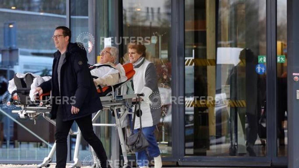 People leave the Elisabeth-TweeSteden Hospital in Tilburg following a case of coronavirus confirmed in the Netherlands. Reuters