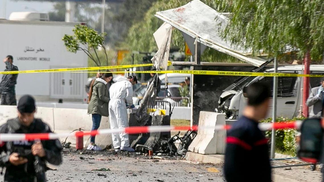 Forensic officers work on a blast site near the US Embassy in Tunis, Friday, March 6, 2020. (AP)