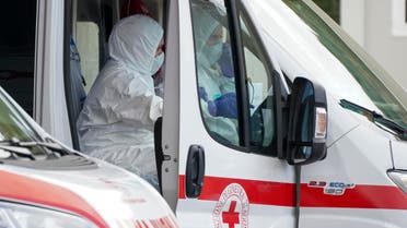 Red Cross personnel prepare for the transport of a Coronavirus patient during a simulation, in Rome on March 6, 2020. (AP)