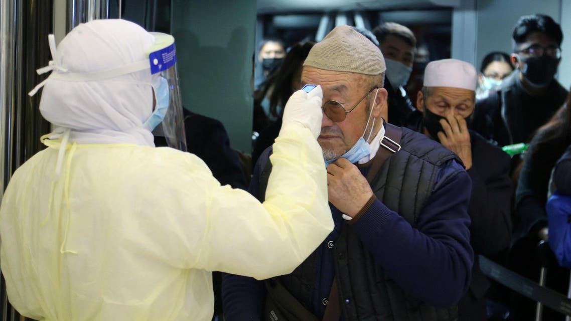 Passengers coming from China wearing masks to prevent coronavirus infection are checked by Saudi Health Ministry employees upon their arrival at King Khalid International Airport, in Riyadh, Saudi Arabia, January 29, 2020. (Reuters)