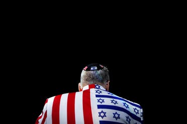 A member of the audience looks on wearing a United States-Israel themed custom suit during the AIPAC convention at the Washington Convention Center in Washington. (Reuters)