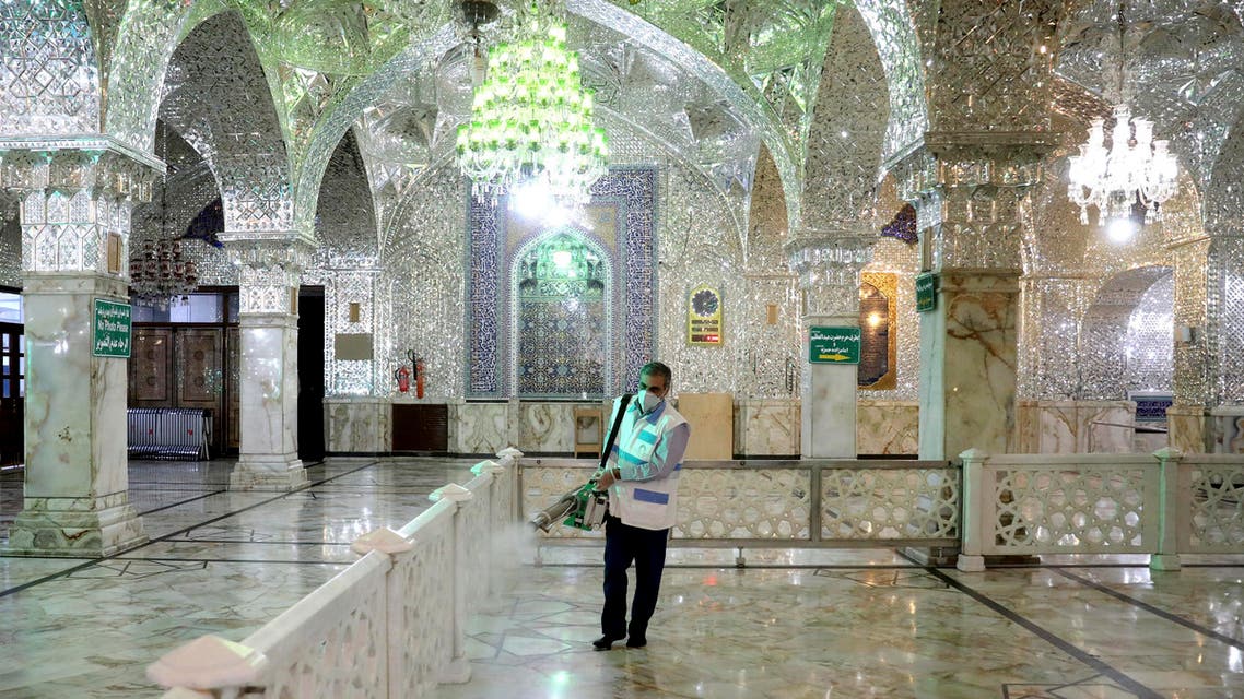 A man disinfects the shrine of the Shia Saint Imam Abdulazim to help prevent the spread of the new coronavirus in Shahr-e-Ray, south of Tehran on March, 7, 2020. (AP)