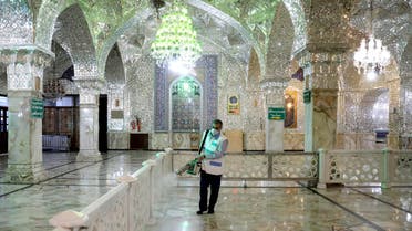 A man disinfects the shrine of the Shia Saint Imam Abdulazim to help prevent the spread of the new coronavirus in Shahr-e-Ray, south of Tehran on March, 7, 2020. (AP)