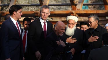 Afghan President Ashraf Ghani, center, arrives with NATO Secretary General Jens Stoltenberg, and U.S. Secretary of Defense Mark Esper for a joint news conference in presidential palace in Kabul (AP)