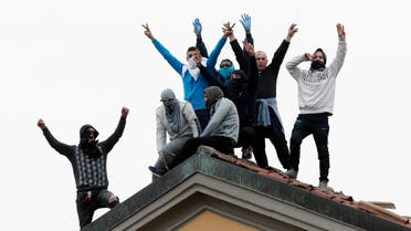 Inmates stage a protest against new rules to cope with coronavirus emergency on the roof of the San Vittore prison in Milan on March 9, 2020. (AP)
