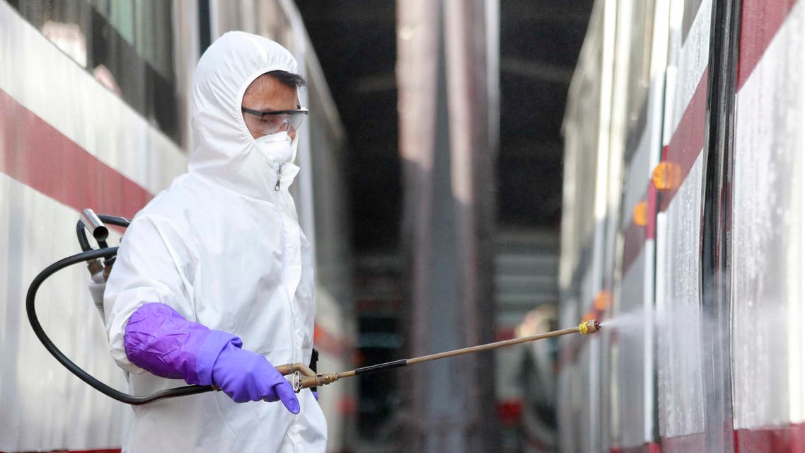 A member from an emergency anti-epidemic headquarters in Mangyongdae District disinfects a tramcar of Songsan Tram Station to prevent new coronavirus infection in Pyongyang, North Korea. (AP)