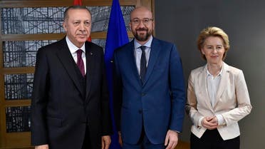 EU Council President Charles Michel (C) and European Commission President Ursula von der Leyen (R) pose with Turkish President Erdogan (L) before their meeting at the EU headquarters in Brussels on March 9, 2020. (AFP)