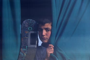 A boy migrant from Syria sits in a bus in the eastern Mediterranean island of Cyprus, on Feb. 4, 2017. (AP)