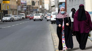 People wearing masks seen in the heart of the Bahraini capital Manama on February 26, 2020. (AFP)