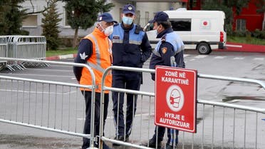 Police guard the entrance to the quarantine zone at the Mother Theresa Hospital in Tirana, where the first 2 patients infected with the COVID-19 coronavirus, are hospitalised on March 9, 2020. (AFP)
