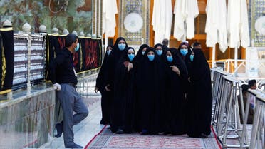 Women wear protective face masks at Imam Ali Shrine, following an outbreak of coronavirus, in the holy city of Najaf. (Reuters)