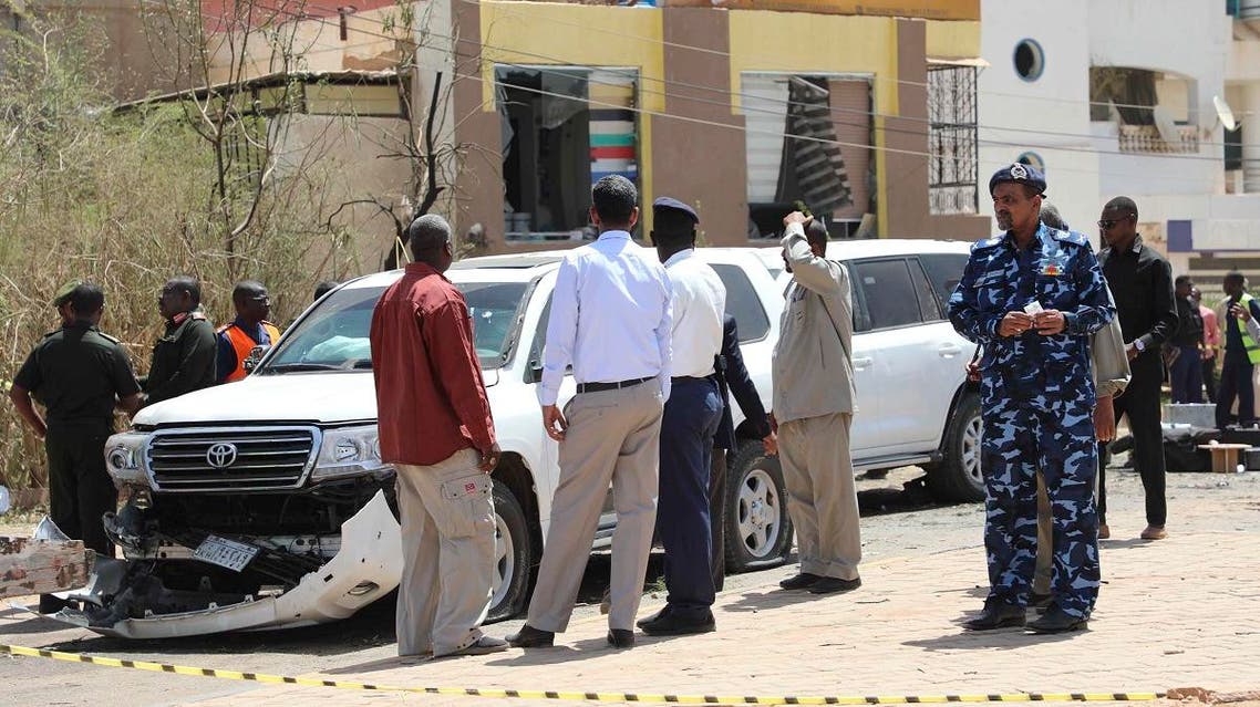 Sudanese policemen stand around vehicles that were part of Prime Mister Abdalla Hamdok's motorcade in Khartoum, Sudan, Monday, March . 9, 2020. (AP)