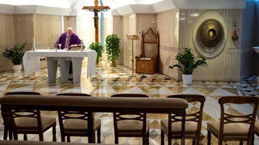 Pope Francis leads Mass via a video livestream in a chapel full of empty seats as part of measures to combat the spread of coronavirus, at the St. Martha House in the Vatican, March 10, 2020. (Reuters)