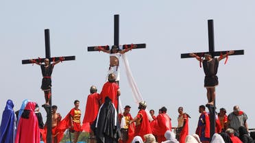 Filipino devotees are nailed on wooden crosses during a crucifixion re-enactment on Good Friday, in San Fernando City, Pampanga province, Philippines, April 19, 2019. (Reuters)