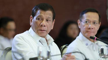 Philippine President Rodrigo Duterte, left, talks beside Health Secretary Francisco Duque II during a meeting with the Inter-Agency Task Force for the Management of Emerging Infectious Diseases at the Malacanang Palace in Manila. (AP)