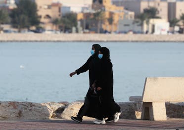 Women wear protective face masks, as they walk, after Saudi Arabia imposed a temporary lockdown on the province of Qatif, following the spread of coronavirus, in Qatif, Saudi Arabia, March 10, 2020. (Reuters)