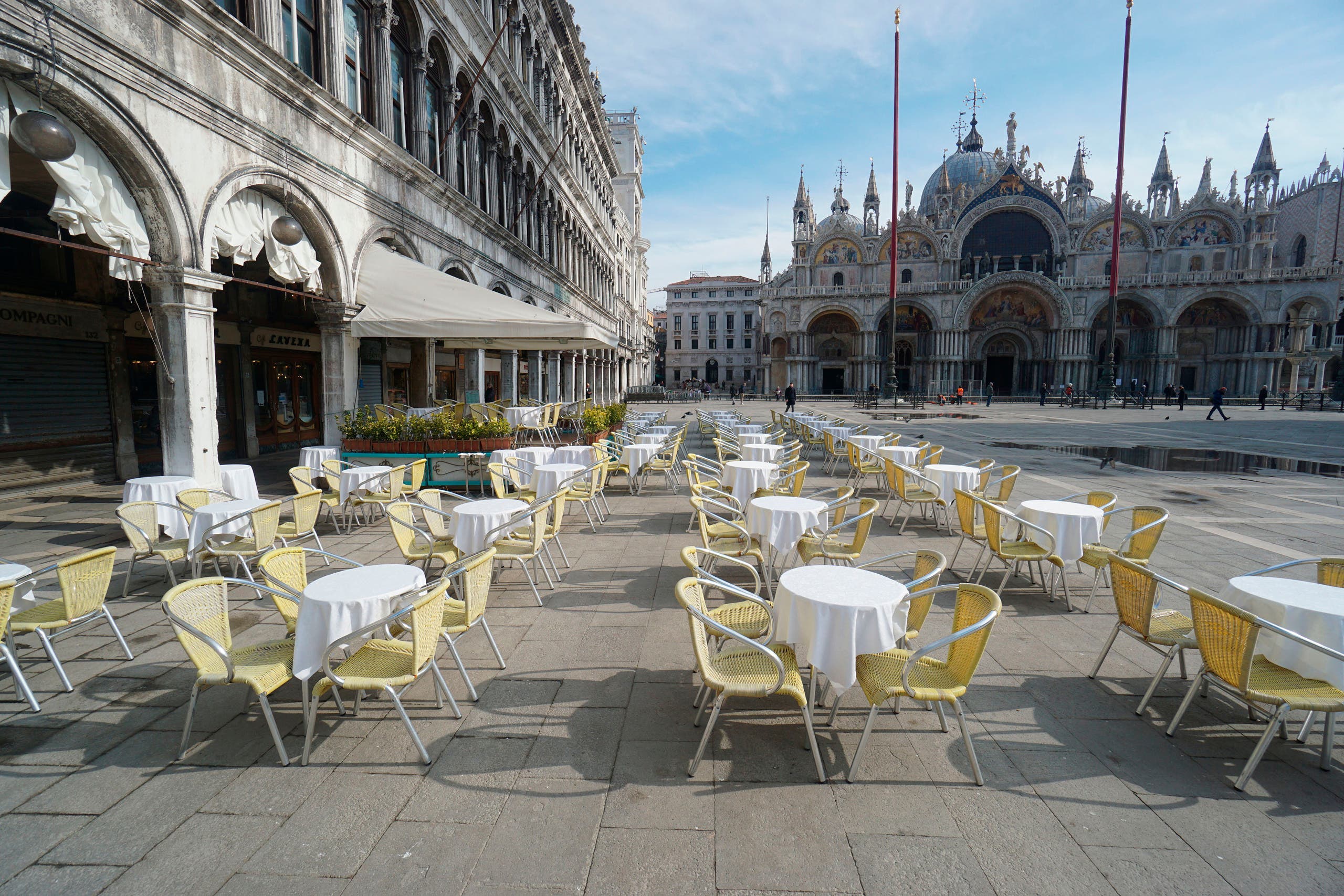 Empty chairs and tables are lined up outside a restaurant in Venice, Italy on March 9, 2020. (AP)