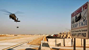 Two UH-60 Black Hawk helicopters from the 1st Air Cavalry Brigade, 1st Cavalry Division, approach for landing at the new passenger terminal at Camp Taji in Baghdad January 4, 2010. (Reuters)