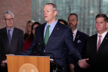 Massachusetts Governor Charlie Baker, center, speaks during a news conference outside Boston City Hall in front of Mayor Marty Walsh, right, and CEO of the Boston Athletic Association Thomas Grilk, left, on Friday, March, 13, 2020, in Boston. (AP) 