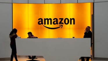   People stand in the lobby for Amazon offices in New York. Amazon says President Donald Trump's ‘improper pressure’ and behind-the-scenes attacks harmed its chances of winning a $10 billion Pentagon contract  (File Photo:AP)