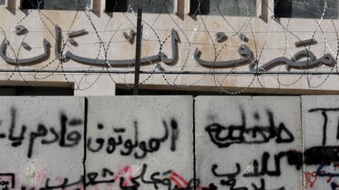 A graffiti that reads in Arabic, “Molotov cocktails are coming,” has been painted on a concrete wall in the entrance of the Lebanese Central Bank, during the protests against the Lebanese government, in Beirut on February 1, 2020. (AP)