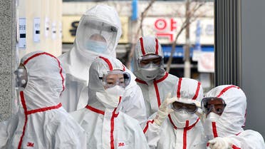 Medical staff members in protective gears arrive for a duty shift at Dongsan Hospital in Daegu, South Korea, on Tuesday, March 3, 2020. (AP)
