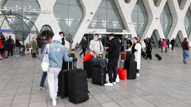 Tourists wait to be repatriated to their countries as Morocco suspends flights to European countries over coronavirus disease (COVID-19) fears, at Marrakech airport, Morocco, March 15, 2020. (Reuters)