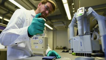 Employee Philipp Hoffmann, of German biopharmaceutical company CureVac, demonstrates research workflow on a vaccine for the coronavirus (COVID-19) at a laboratory in Tuebingen, Germany, March 12, 2020. (Reuters)