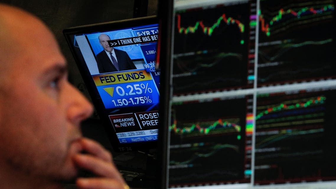 A screen displays the US Federal Reserve interest rates announcement as traders work on the floor of the New York Stock Exchange (NYSE) in New York, US, October 30, 2019. (File photo: Reuters)