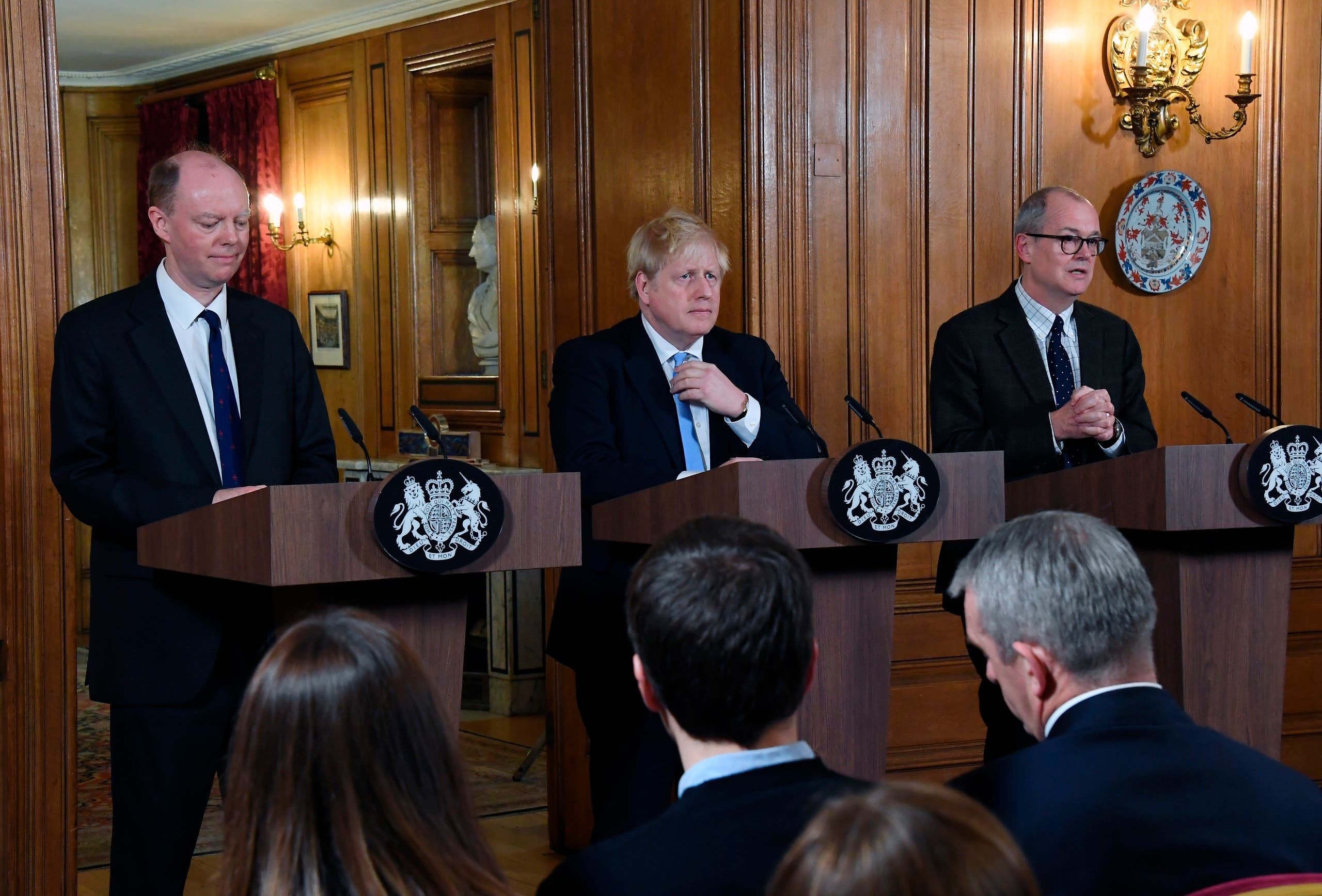 Chief Medical Officer for England Chris Witty, Britain Prime Minister Boris Johnson and Chief Scientific Adviser Patrick Vallance speak during a press conference about coronavirus in London on March 9, 2020. (AP)
