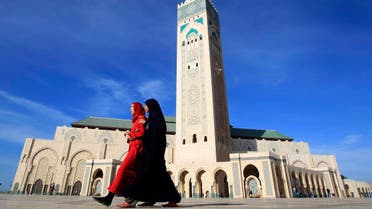Moroccan women walk past the Hassan II mosque in Casablanca February 24, 2011. (Reuters)