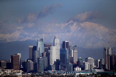 Snow covers the San Gabriel Mountains behind the downtown skyline after a series of storms Friday, Dec. 27, 2019, in Los Angeles. (File photo: AP)