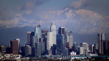 Snow covers the San Gabriel Mountains behind the downtown skyline after a series of storms Friday, Dec. 27, 2019, in Los Angeles. (File photo: AP)