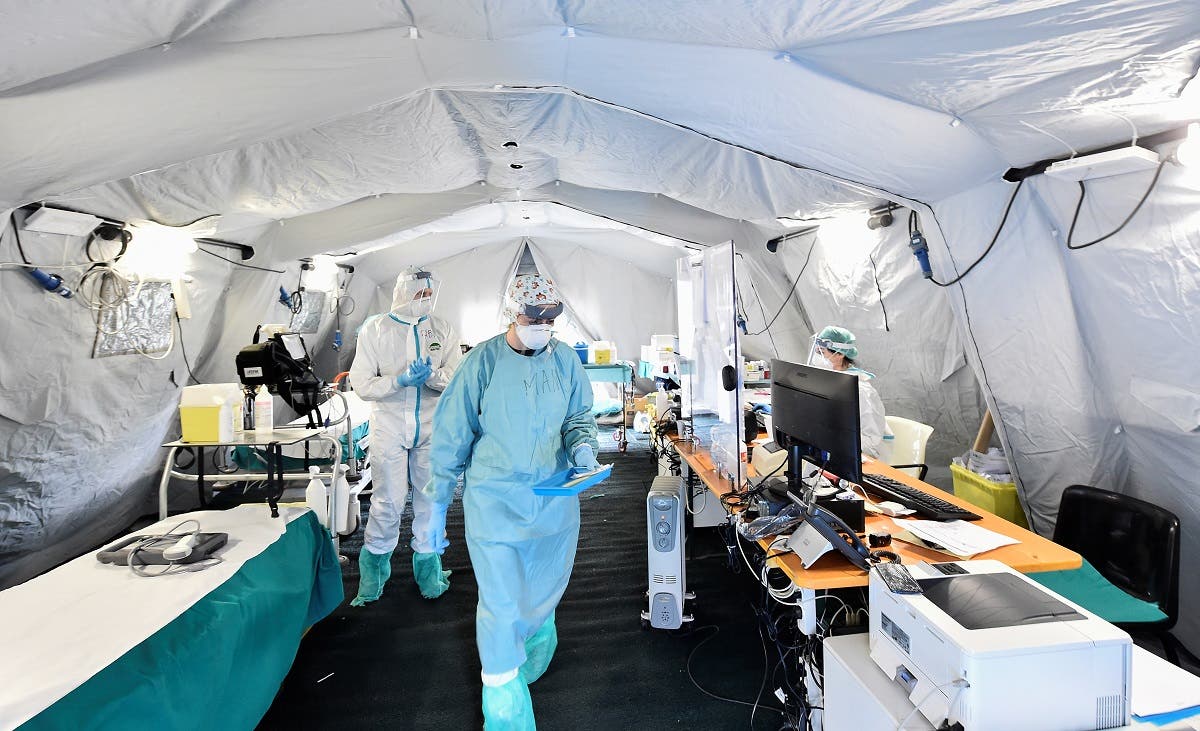 Medical personnel wearing protective face masks is seen inside the Spedali Civili hospital in Brescia, Italy March 13, 2020. (Reuters)