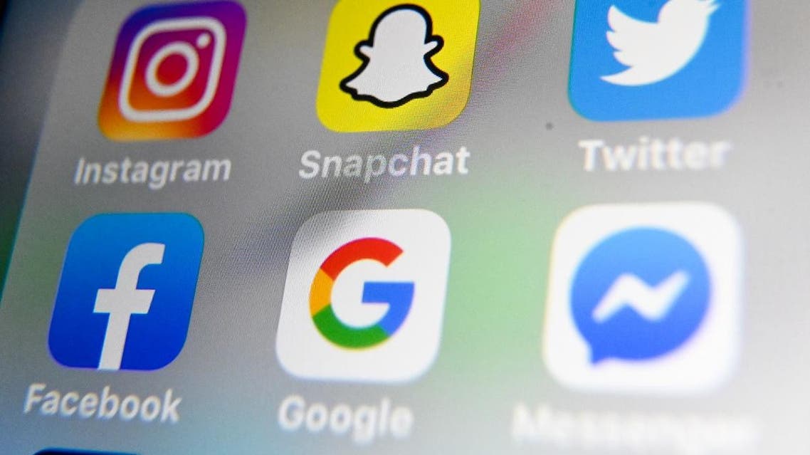 A picture taken on October 1, 2019 in Lille shows the logos of mobile apps Instagram, Snapchat, Twitter, Facebook, Google and Messenger displayed on a tablet. (File photo: AFP)
