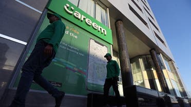 Careem employees walk past the company headquarters in Dubai. (Reuters)
