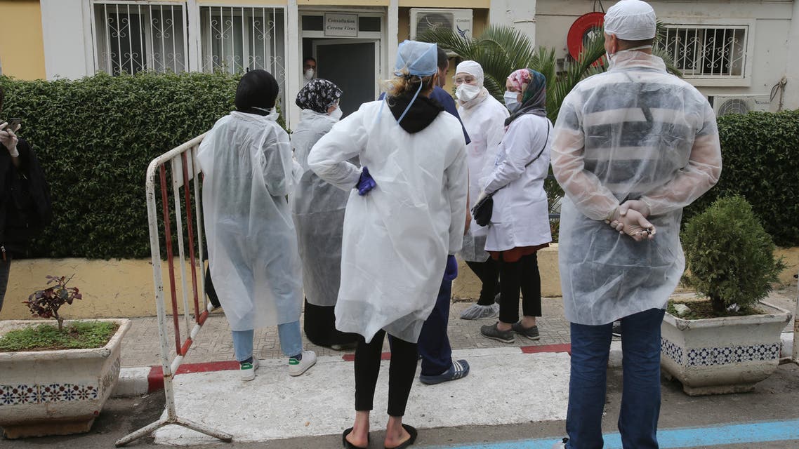 Member of the medical personnel and peolpes wearing a protective face mask is pictured in Hospital in Algiers, Algeria March 16, 2020.REUTERS/Ramzi Boudina