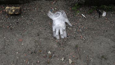 Gloves are seen on the ground of a street, following the outbreak of coronavirus, in Tehran. (File photo: Reuters)