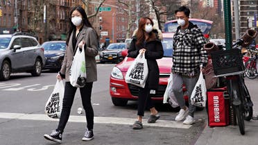 NEW YORK, NY - MARCH 16: Shoppers wear protective face masks as they leave Fairway Market as coronavirus continues to spread across the United States on March 16, 2020 in New York City. The World Health Organization declared coronavirus (COVID-19) a global pandemic on March 11th. Cindy Ord/Getty Images/AFP