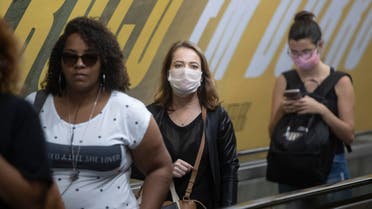 Commuters wear face masks as a precaution against the spread of the new coronavirus in a subway station in Sao Paulo, Brazil, Monday, March 16, 2020. (AP)