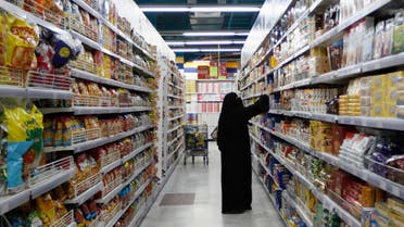 A woman looks at products as she buys food supplies at a supermarket in Dubai. (File photo: Reuters)