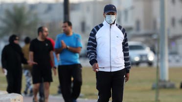 A man wears a protective face mask, as he walks, after Saudi Arabia imposed a temporary lockdown on the province of Qatif, following the spread of coronavirus, in Qatif. (Reuters)