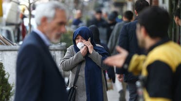 An Iranian woman wears a protective face mask, following the coronavirus outbreak, as she talks on the phone, in Tehran, Iran March 5, 2020. WANA (West Asia News Agency)/Nazanin Tabatabaee via REUTERS ATTENTION EDITORS - THIS IMAGE HAS BEEN SUPPLIED BY A THIRD PARTY.
