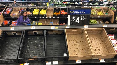Display baskets are nearly empty in the produce section of a Walmart in Warrington, Pennsylvania, on March 17, 2020. Concerns over the new coronavirus have led to consumer panic buying of grocery staples in stores across the country. (AP)