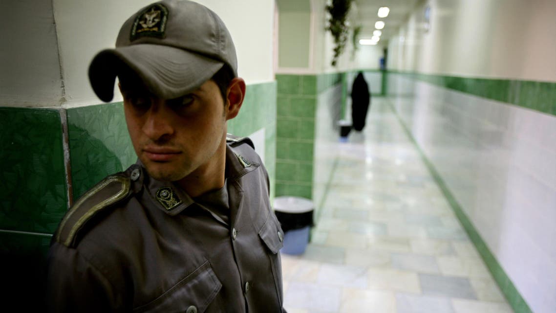 A prison guard stands along a corridor in Tehran's Evin prison June 13, 2006. (AP)