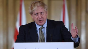 Britain's Prime Minister Boris Johnson addresses a news conference to give a daily update on the government's response to the novel coronavirus COVID-19 outbreak, inside 10 Downing Street in London on March 18, 2020. (AFP)