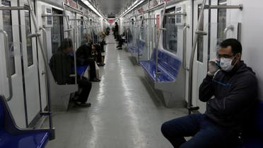 People wear protective face masks, following the outbreak of coronavirus, as they sit in a metro in Tehran, Iran March 17, 2020. WANA (West Asia News Agency)/Ali Khara via REUTERS ATTENTION EDITORS - THIS PICTURE WAS PROVIDED BY A THIRD PARTY