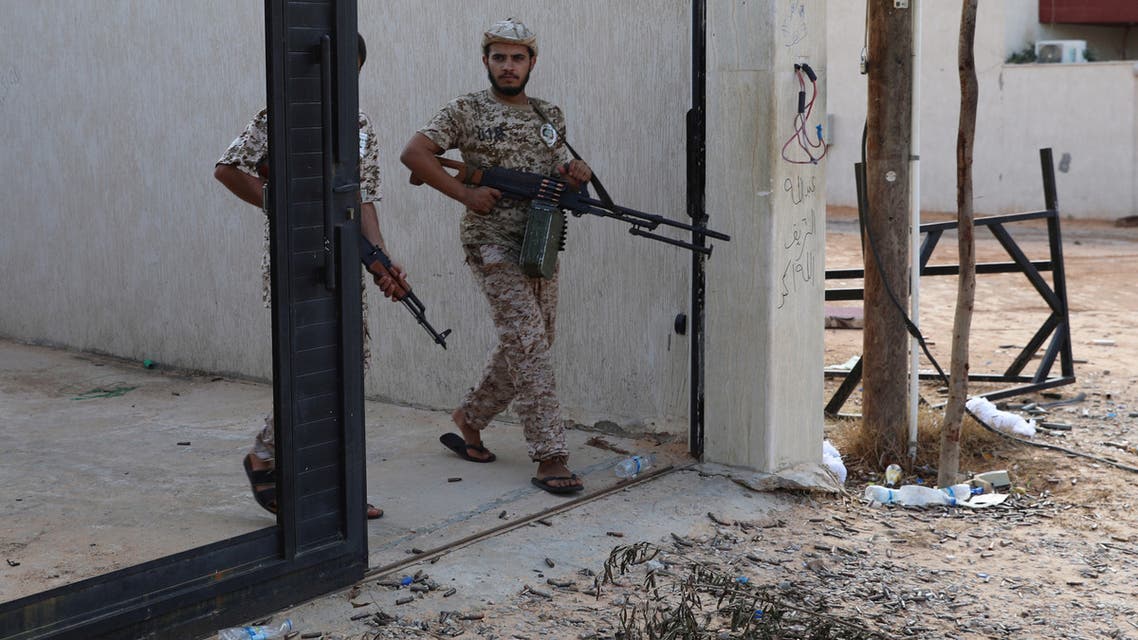 Members of the Libyan internationally recognized government forces carry weapons in Ain Zara, Tripoli, Libya October 14, 2019. Picture taken October 14, 2019. REUTERS/Ismail Zitouny