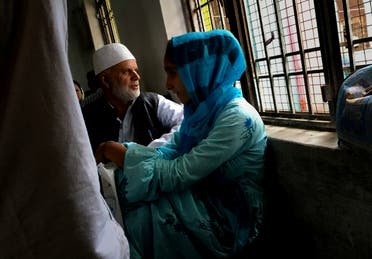 A Kashmiri family awaits their turn to meet a relative in Agra Central Jail in Agra, India on Sept. 20, 2019. (AP)