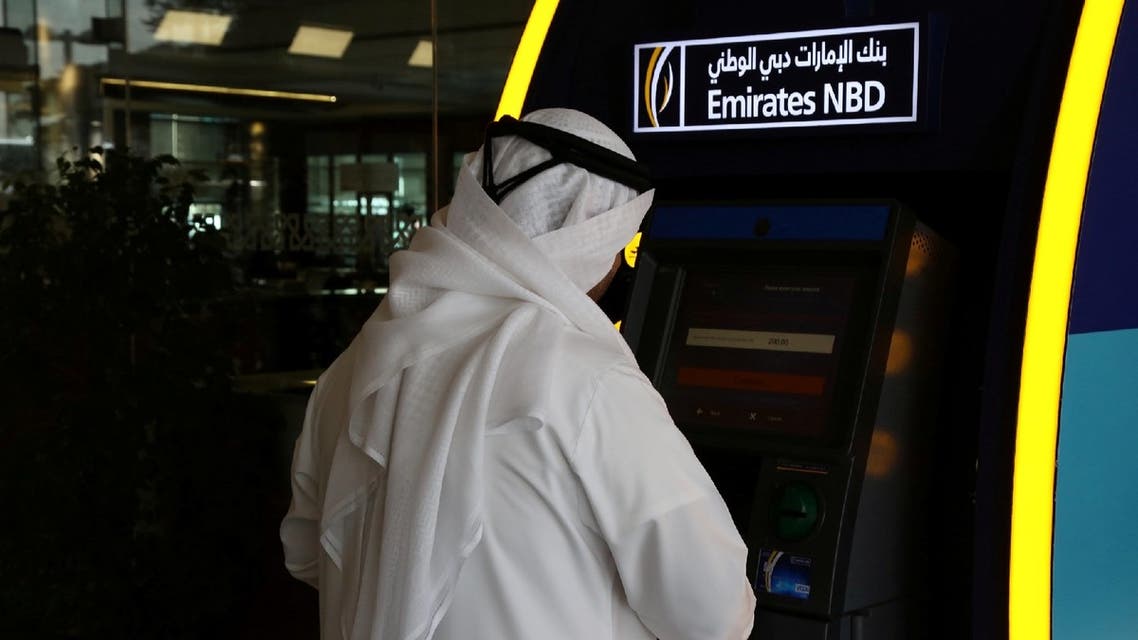 A customer uses an ATM machine at the Emirates NBD head office in Dubai, UAE, January 30, 2018. (Reuters)